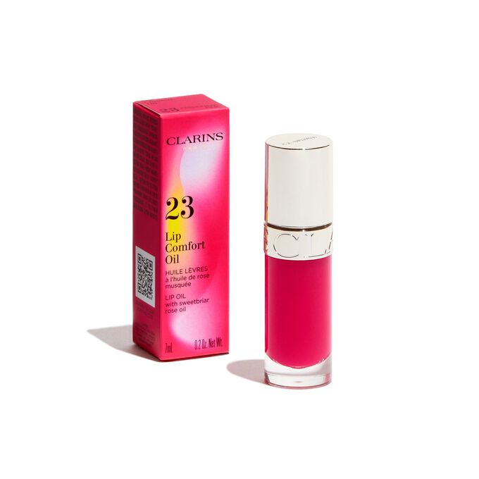 Foto de Lip Comfort Oil rosa de Clarins de la colección Power of Colours, junto a su envase