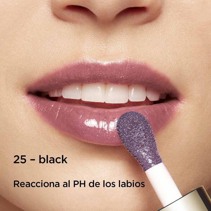 Close-up of smiling lips to showcase the texture and color of the black lip oil shade on her skin tone that reacts to lips' PH